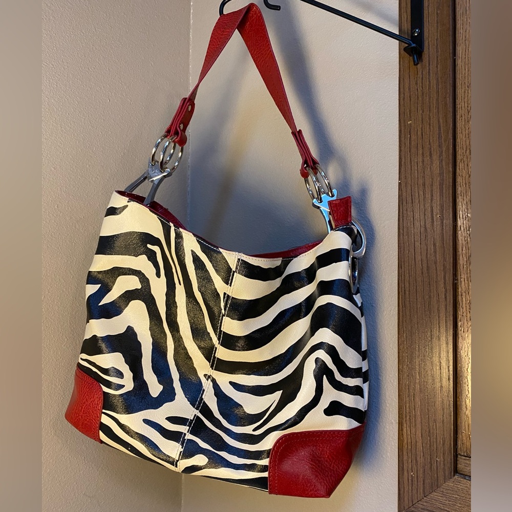 Beautiful zebra pattern red, black and white purse, like new, zips closed